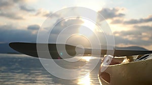 Kayak on the beach forward view from sea kayak on calm water at beautiful summer sunset with lens flare effects, no