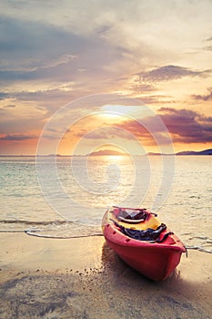 Kayak on the beach in sunset, selective focus and shallow depth of field, vintage tone, soft focus