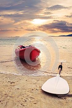 Kayak on the beach in sunset, selective focus and shallow depth of field, vintage tone, soft focus