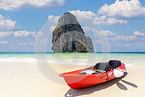 Kayak boat on the beach with poda island background and blue sky