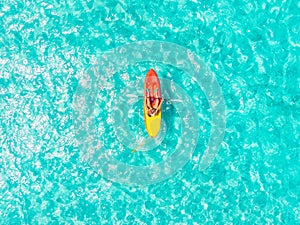 Kayak boat turquoise blue water sea, sunny day. Concept travel. Aerial top view