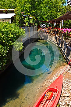 Kayak in the channel with bright blue water. Budva.