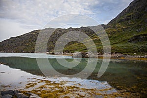 Kayak expedition between icebergs in Narsaq fiords, South West Greenland, Denmark