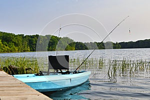 Kayak with fishing poles docked on Lake Sagatagan