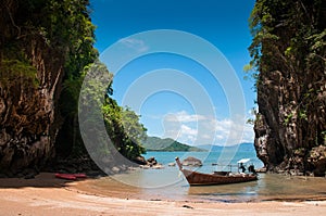 Kayak and longtail boat at beach of Koh Talabeng near Koh Lanta, Krabi, Thailand