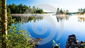 Kayak, morning mist, crescent lake