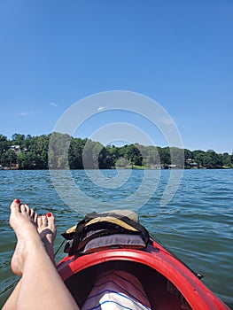 Kayak paddle river water feet relax red toenails red blueskies