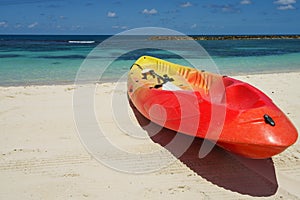 Kayak and paddle by the seashore on the beautiful white sand of Labadee, Haiti. photo