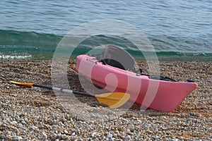 Kayak on a pebble beach