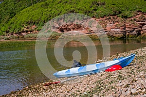 Kayak by the river on beach