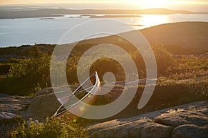 Kayak on a rock near the ocean during sunrise