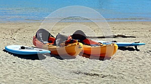 Kayak and surf boards watersports at beach in Costa Rica