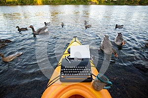 Kayak with a typewriter
