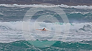 Kayaker Conquering Ocean Waves