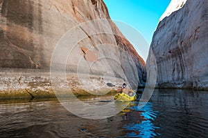 Kayaker paddling the calm waters of Lake Powell Utah