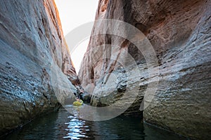 Kayaker paddling the calm waters of Lake Powell Utah