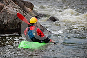 Kayaker is ready to training on a rough water.