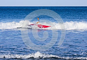 Kayaker in rough sea