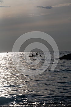 kayaker silhouette in the sea