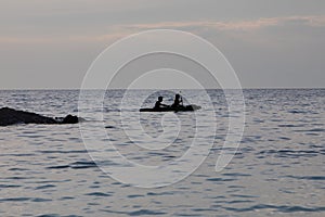 kayaker silhouette in the sea