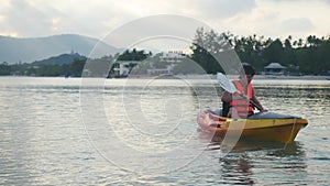 Kayaker is sitting on kayak floating and water splashing. 3840x2160