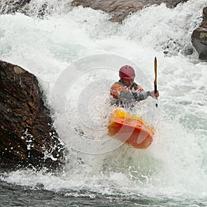 Kayaker in the waterfall