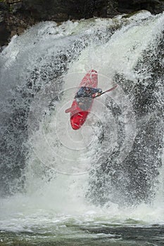 Kayaker in the waterfall
