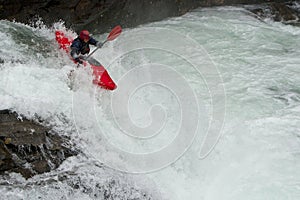 Kayaker in the waterfall