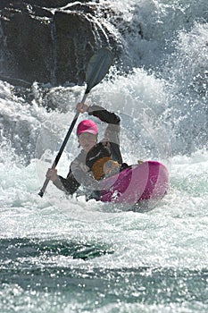 Kayaker on the waterfall in Norway
