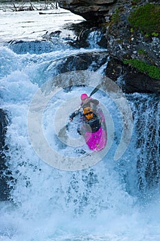 Kayaker on the waterfall in Norway