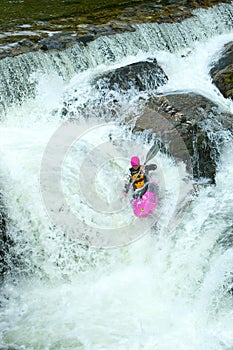 Kayaker on the waterfall in Norway