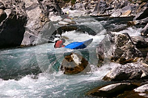 Kayaker in white water, rafting