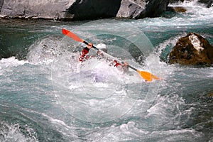 Kayaker in white water, rafting