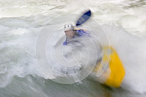Kayaker in whitewater rapids