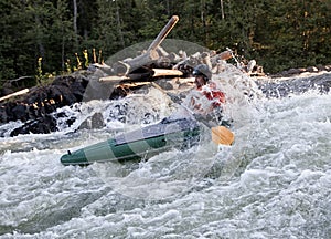 Kayaker in whitewater