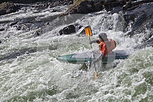 Kayaker in whitewater