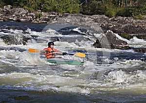 Kayaker in whitewater