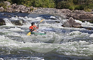 Kayaker in whitewater