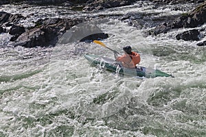 Kayaker in whitewater