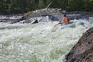 Kayaker in whitewater