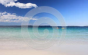 Kayakers enjoy the crystal clear waters Australian Beach