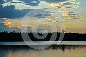 Kayakers on Lake at Sunset