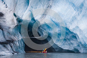 Kayaking into blue ice cave