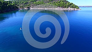 Kayaking / canoeing at Siderona bay, Greece, on a lovely bright day in a calm blue and turquoise sea.