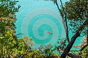 Kayaking at the coast of famous Abel Tasman National Park, New Zealand