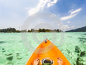 kayaking in crystal clear tropical waters - kayak heading to  beach in Ko Tarutao national park