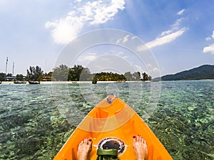 kayaking in crystal clear tropical waters - kayak heading to  beach in Ko Tarutao national park