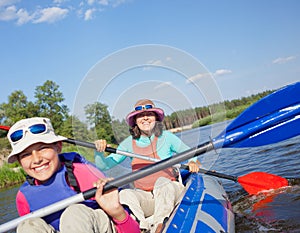 Kayaking on river.