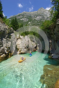 Kayaking through river gorge