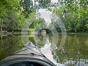 Kayaking on a river one summer day.